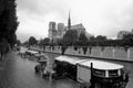 Tourist boat floats on the channel near Notre Dame de Paris. Royalty Free Stock Photo